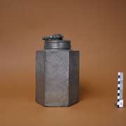 Hexagonal tin container with screw-lid and handle